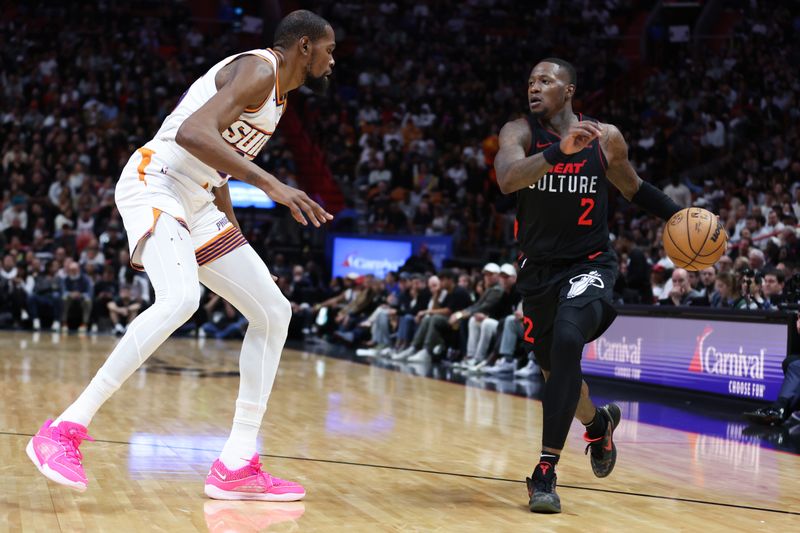 MIAMI, FLORIDA - JANUARY 29: Terry Rozier #2 of the Miami Heat drives against Kevin Durant #35 of the Phoenix Suns during the third quarter of the game at Kaseya Center on January 29, 2024 in Miami, Florida. NOTE TO USER: User expressly acknowledges and agrees that, by downloading and or using this photograph, User is consenting to the terms and conditions of the Getty Images License Agreement. (Photo by Megan Briggs/Getty Images)