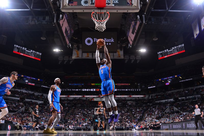 SAN ANTONIO, TX - MARCH 2:  Luguentz Dort #5 of the Oklahoma City Thunder rebounds the ball during the game against the San Antonio Spurs on March 2, 2025 at the Frost Bank Center in San Antonio, Texas. NOTE TO USER: User expressly acknowledges and agrees that, by downloading and or using this photograph, user is consenting to the terms and conditions of the Getty Images License Agreement. Mandatory Copyright Notice: Copyright 2025 NBAE (Photos by Michael Gonzales/NBAE via Getty Images)