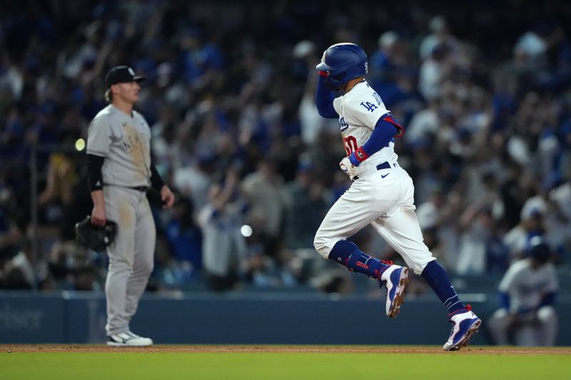 Jun 2, 2023; Los Angeles, California, USA; Los Angeles Dodgers right fielder Mookie Betts (50) rounds the bases after hitting a home run in the sixth inning against the New York Yankees  at Dodger Stadium. Mandatory Credit: Kirby Lee-USA TODAY Sports