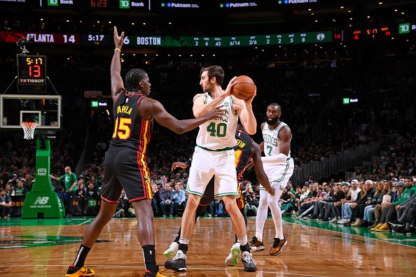 BOSTON, MA - November 26: Luke Kornet #40 of the Boston Celtics handles the ball during the game against the Atlanta Hawks on November 26, 2023 at the TD Garden in Boston, Massachusetts. NOTE TO USER: User expressly acknowledges and agrees that, by downloading and or using this photograph, User is consenting to the terms and conditions of the Getty Images License Agreement. Mandatory Copyright Notice: Copyright 2023 NBAE  (Photo by Brian Babineau/NBAE via Getty Images)