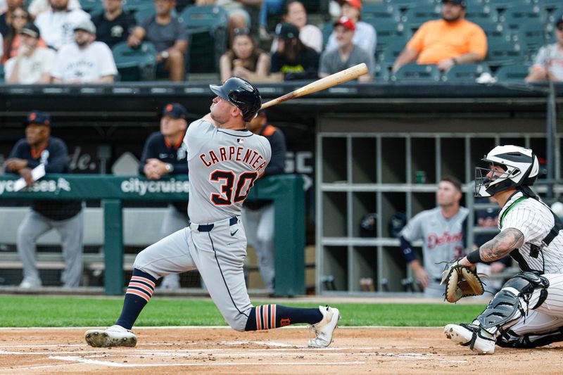 Jun 2, 2025; Chicago, Illinois, USA; Detroit Tigers designated hitter Kerry Carpenter (30) hits a two-run home run against the Chicago White Sox during the first inning at Rate Field. Mandatory Credit: Kamil Krzaczynski-Imagn Images