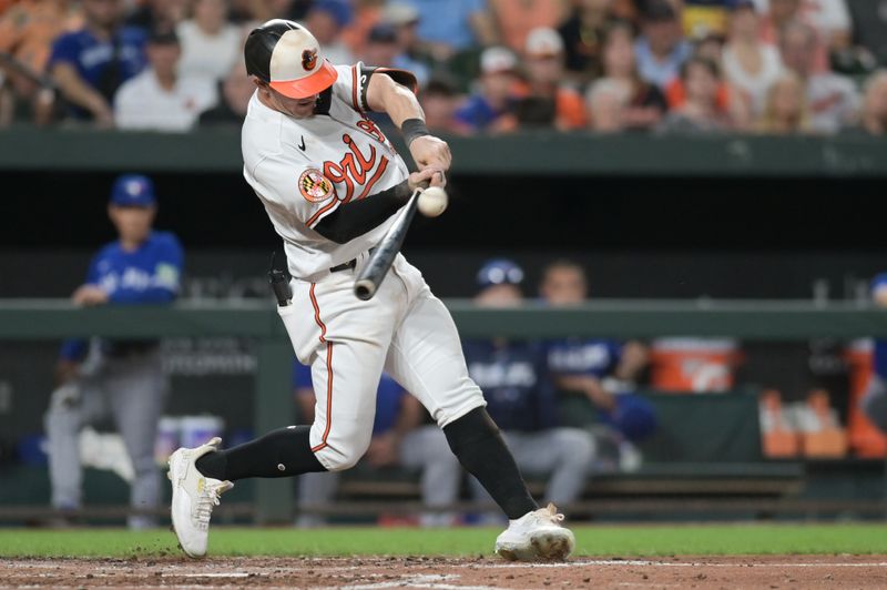 Aug 23, 2023; Baltimore, Maryland, USA;  Baltimore Orioles left fielder Austin Hays (21) hits a third inning double against the Toronto Blue Jays at Oriole Park at Camden Yards. Mandatory Credit: Tommy Gilligan-USA TODAY Sports