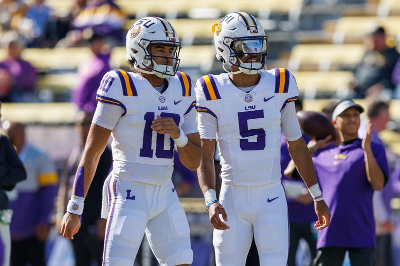 Nov 25, 2023; Baton Rouge, Louisiana, USA;  LSU Tigers quarterback Jayden Daniels (5) and  quarterback Rickie Collins (10) during warmups before the game against the Texas A&M Aggies at Tiger Stadium. Mandatory Credit: Stephen Lew-USA TODAY Sports