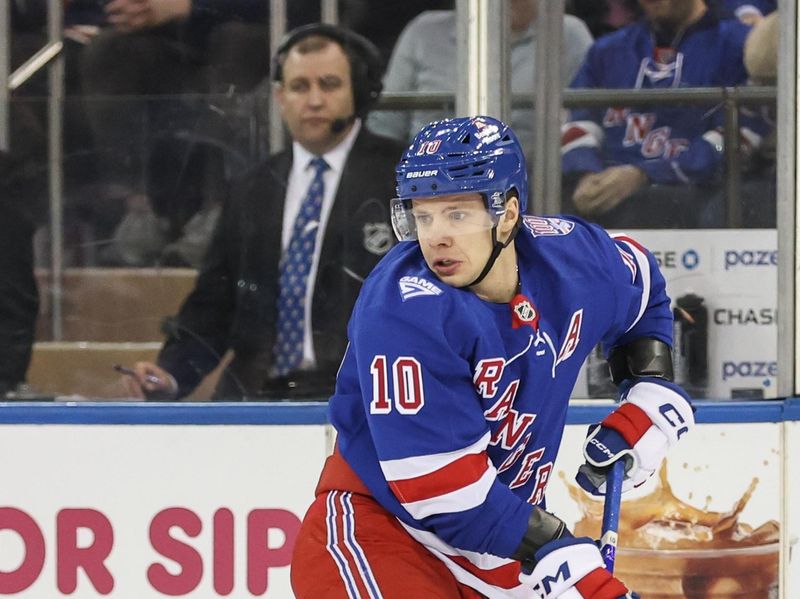 Jan 14, 2026; New York, New York, USA;  New York Rangers left wing Artemi Panarin (10) controls the puck in the first period against the Ottawa Senators at Madison Square Garden. Mandatory Credit: Wendell Cruz-Imagn Images