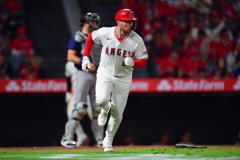 Aug 30, 2024; Anaheim, California, USA; Los Angeles Angels second baseman Brandon Drury (23) runs after hitting an RBI single against the Seattle Mariners during the sixth inning at Angel Stadium. Mandatory Credit: Gary A. Vasquez-USA TODAY Sports