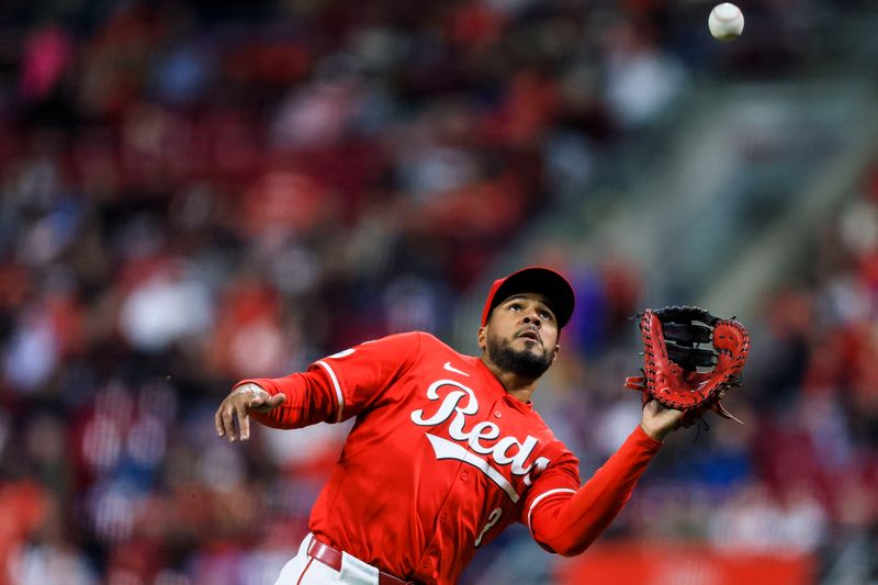 Apr 12, 2025; Cincinnati, Ohio, USA; Cincinnati Reds first baseman Jeimer Candelario (3) catches a pop up hit by Pittsburgh Pirates outfielder Tommy Pham (not pictured) in the ninth inning at Great American Ball Park. Mandatory Credit: Katie Stratman-Imagn Images
