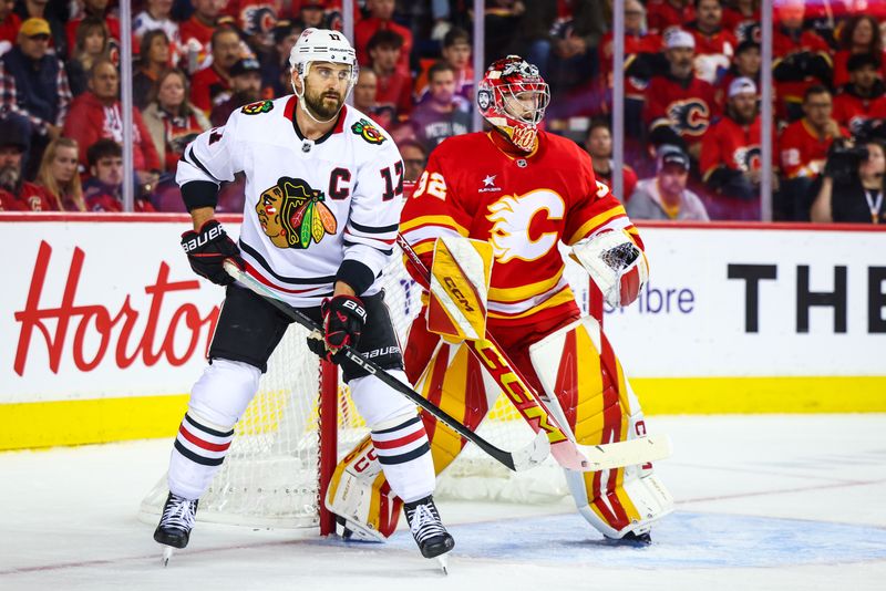 Oct 15, 2024; Calgary, Alberta, CAN; Chicago Blackhawks left wing Nick Foligno (17) screens in front of Calgary Flames goaltender Dustin Wolf (32) during the first period at Scotiabank Saddledome. Mandatory Credit: Sergei Belski-Imagn Images