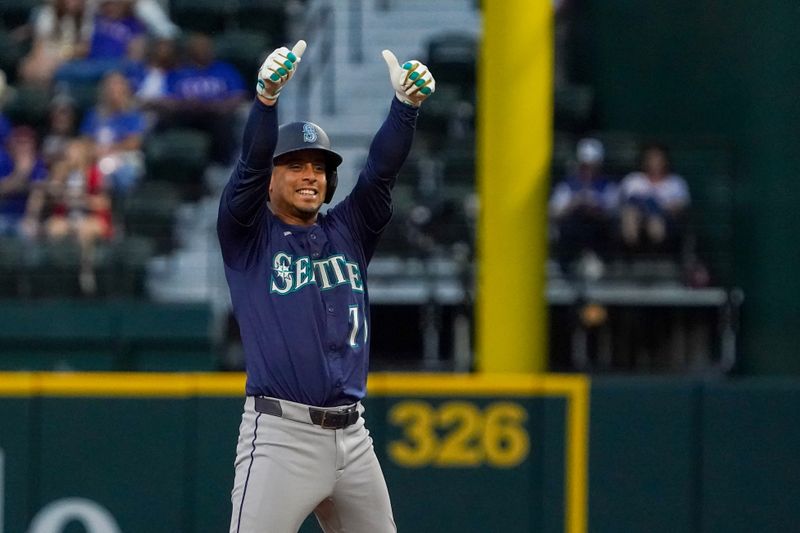May 3, 2025; Arlington, Texas, USA; Seattle Mariners second baseman Leo Rivas (76) reacts towards the dugout after hitting a double during the seventh inning against the Texas Rangers at Globe Life Field. Mandatory Credit: Raymond Carlin III-Imagn Images