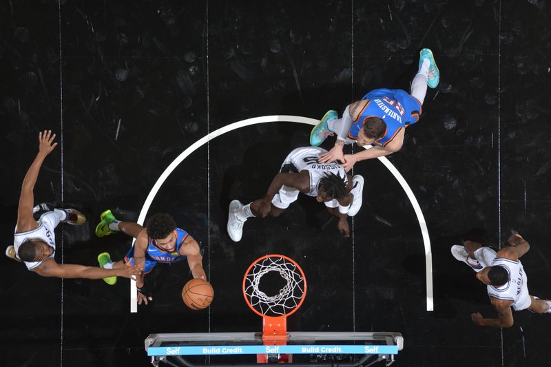 SAN ANTONIO, TX - OCTOBER 7: Ajay Mitchell #25 of the Oklahoma City Thunder drives to the basket during the game against the San Antonio Spurs during a NBA preseason game on October 7, 2024 at the Frost Bank Center in San Antonio, Texas. NOTE TO USER: User expressly acknowledges and agrees that, by downloading and or using this photograph, user is consenting to the terms and conditions of the Getty Images License Agreement. Mandatory Copyright Notice: Copyright 2024 NBAE (Photos by Michael Gonzales/NBAE via Getty Images)