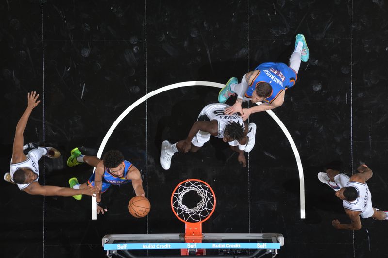 SAN ANTONIO, TX - OCTOBER 7: Ajay Mitchell #25 of the Oklahoma City Thunder drives to the basket during the game against the San Antonio Spurs during a NBA preseason game on October 7, 2024 at the Frost Bank Center in San Antonio, Texas. NOTE TO USER: User expressly acknowledges and agrees that, by downloading and or using this photograph, user is consenting to the terms and conditions of the Getty Images License Agreement. Mandatory Copyright Notice: Copyright 2024 NBAE (Photos by Michael Gonzales/NBAE via Getty Images)