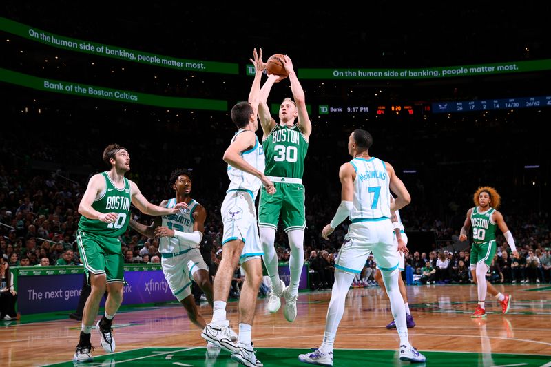 BOSTON, MA - APRIL 12:  Sam Hauser #30 of the Boston Celtics shoots the ball during the game against the Charlotte Hornets on April 12, 2024 at the TD Garden in Boston, Massachusetts. NOTE TO USER: User expressly acknowledges and agrees that, by downloading and or using this photograph, User is consenting to the terms and conditions of the Getty Images License Agreement. Mandatory Copyright Notice: Copyright 2024 NBAE  (Photo by Brian Babineau/NBAE via Getty Images)