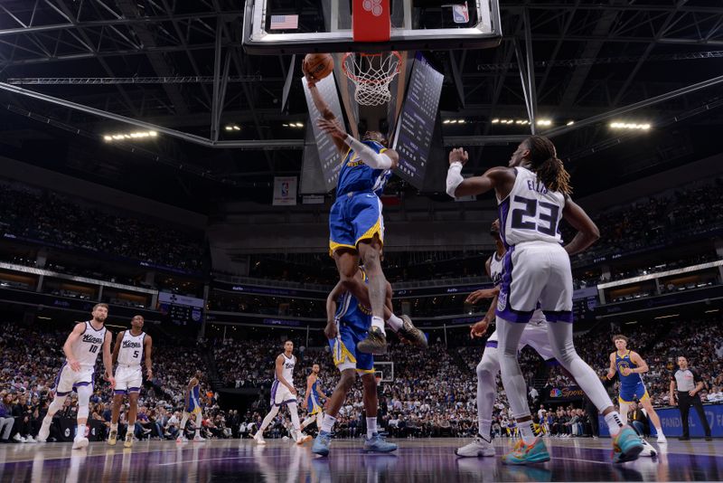 SACRAMENTO, CA - APRIL 16: Jonathan Kuminga #00 of the Golden State Warriors drives to the basket during the game against the Sacramento Kings during the 2024 Play-In Tournament on April 16, 2024 at Golden 1 Center in Sacramento, California. NOTE TO USER: User expressly acknowledges and agrees that, by downloading and or using this Photograph, user is consenting to the terms and conditions of the Getty Images License Agreement. Mandatory Copyright Notice: Copyright 2024 NBAE (Photo by Rocky Widner/NBAE via Getty Images)