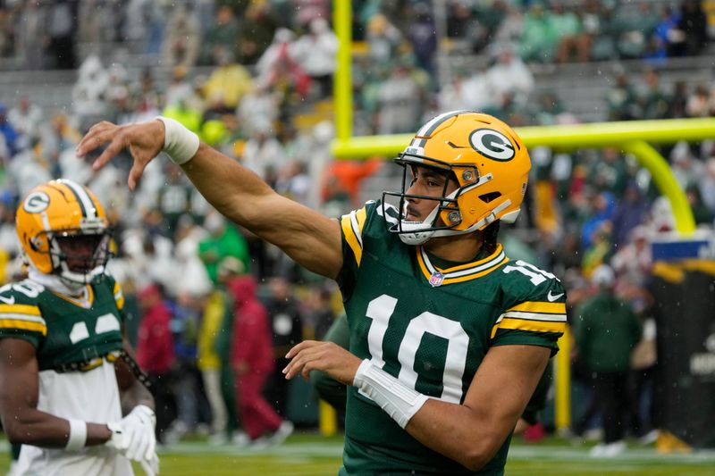 Green Bay Packers quarterback Jordan Love warms up during pregame of an NFL football game against the Arizona Cardinals, Sunday, Oct. 13, 2024, in Green Bay. (AP Photo/Morry Gash)