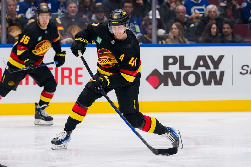 Dec 23, 2023; Vancouver, British Columbia, CAN; Vancouver Canucks forward Elias Pettersson (40) shoots against the San Jose Sharks in the third period at Rogers Arena. Canucks won 7-4. Mandatory Credit: Bob Frid-USA TODAY Sports