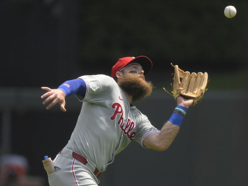 Jul 24, 2024; Minneapolis, Minnesota, USA;  Philadelphia Phillies outfielder Brandon Marsh (16) catches a fly ball for an out against the Minnesota Twins during the second inning at Target Field. Mandatory Credit: Nick Wosika-USA TODAY Sports