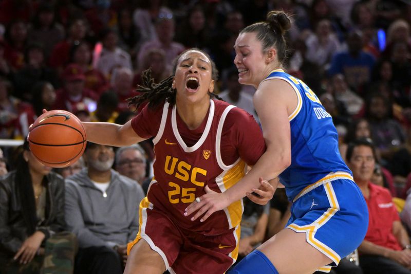 Jan 14, 2024; Los Angeles, California, USA; USC Trojans guard McKenzie Forbes (25) is fouled by UCLA Bruins forward Angela Dugalic (32) in the second half at Galen Center. Mandatory Credit: Jayne Kamin-Oncea-USA TODAY Sports