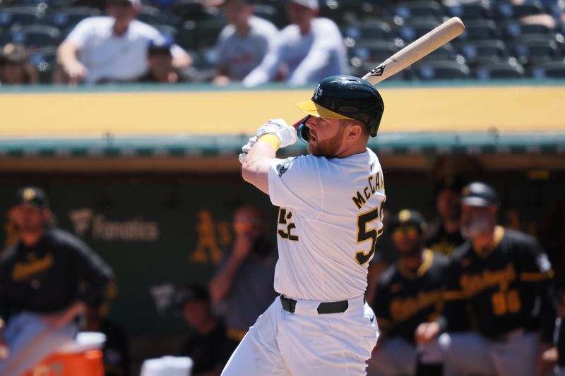 May 1, 2024; Oakland, California, USA; Oakland Athletics catcher Kyle McCann (52) hits a single against the Pittsburg Pirates during the second inning at Oakland-Alameda County Coliseum. Mandatory Credit: Kelley L Cox-USA TODAY Sports