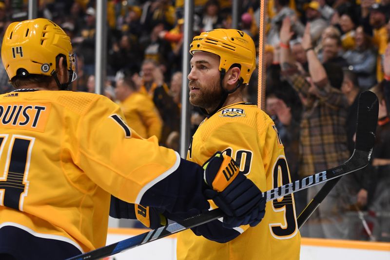 Feb 29, 2024; Nashville, Tennessee, USA; Nashville Predators center Ryan O'Reilly (90) celebrates with center Gustav Nyquist (14) after a goal during the third period against the Minnesota Wild at Bridgestone Arena. Mandatory Credit: Christopher Hanewinckel-USA TODAY Sports