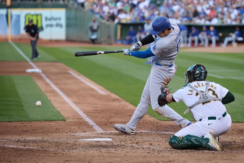 Aug 3, 2024; Oakland, California, USA; Los Angeles Dodgers designated hitter Shohei Ohtani (17) bats against the Oakland Athletics during the fifth inning at Oakland-Alameda County Coliseum. Mandatory Credit: Robert Edwards-USA TODAY Sports