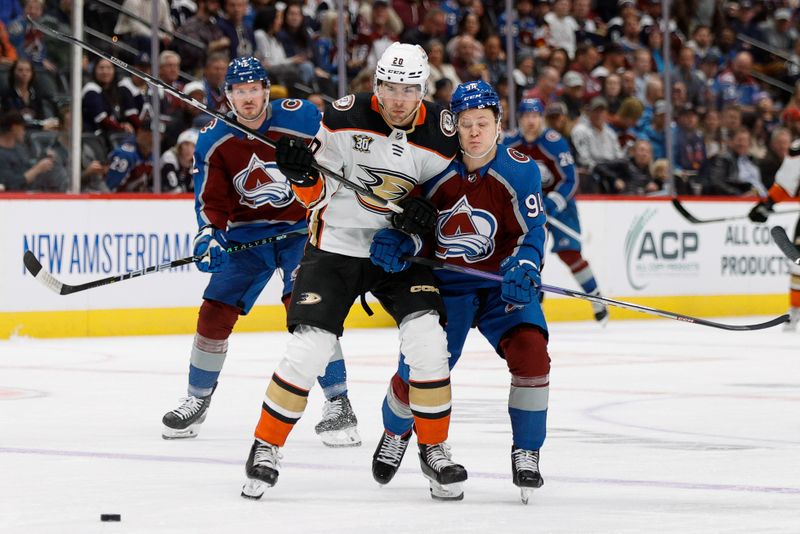 Dec 5, 2023; Denver, Colorado, USA; Anaheim Ducks right wing Brett Leason (20) and Colorado Avalanche center Joel Kiviranta (94) battle for position in the first period at Ball Arena. Mandatory Credit: Isaiah J. Downing-USA TODAY Sports