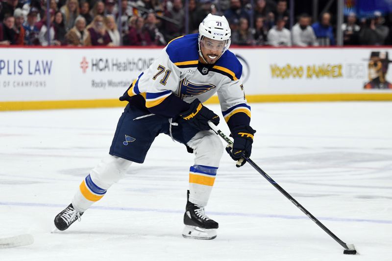 Jan 31, 2025; Denver, Colorado, USA; St. Louis Blues right wing Mathieu Joseph (71) skates with the puck during the first period against the Colorado Avalanche at Ball Arena. Mandatory Credit: Christopher Hanewinckel-Imagn Images