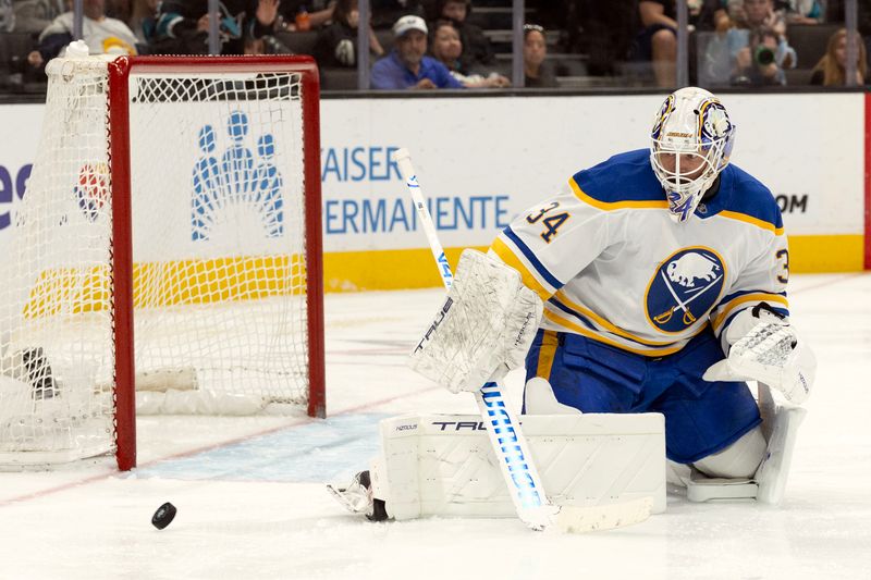 Mar 19, 2026; San Jose, California, USA; Buffalo Sabres goaltender Alex Lyon (34) deflects a shot on goal by the San Jose Sharks during the second period at SAP Center at San Jose. Mandatory Credit: D. Ross Cameron-Imagn Images