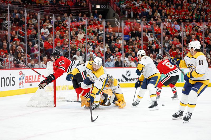 Mar 22, 2026; Chicago, Illinois, USA; Chicago Blackhawks defenseman Artyom Levshunov (55) collides with Nashville Predators defenseman Roman Josi (59) as they battle for the puck during the first period at United Center. Mandatory Credit: Kamil Krzaczynski-Imagn Images