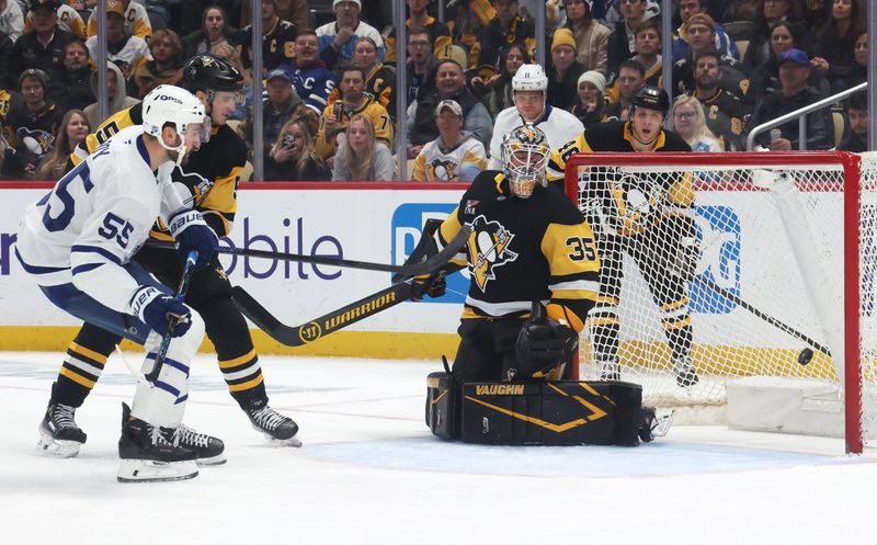 Nov 29, 2025; Pittsburgh, Pennsylvania, USA;  Toronto Maple Leafs center Nicolas Roy (55) scores a goal against Pittsburgh Penguins goaltender Tristan Jarry (35) during the second period at PPG Paints Arena. Mandatory Credit: Charles LeClaire-Imagn Images
