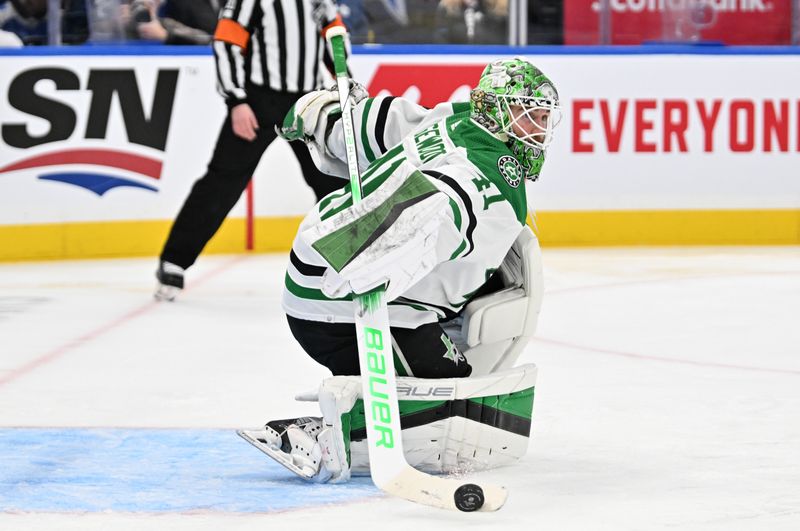 Feb 7, 2024; Toronto, Ontario, CAN; Dallas Stars goalie Scott Wedgewood (41) makes a save against the Toronto Maple Leafs in the first period at Scotiabank Arena. Mandatory Credit: Dan Hamilton-USA TODAY Sports