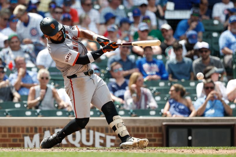 Jun 19, 2024; Chicago, Illinois, USA; San Francisco Giants outfielder Heliot Ramos (17) grounds into force out against the Chicago Cubs during the sixth inning at Wrigley Field. Mandatory Credit: Kamil Krzaczynski-USA TODAY Sports