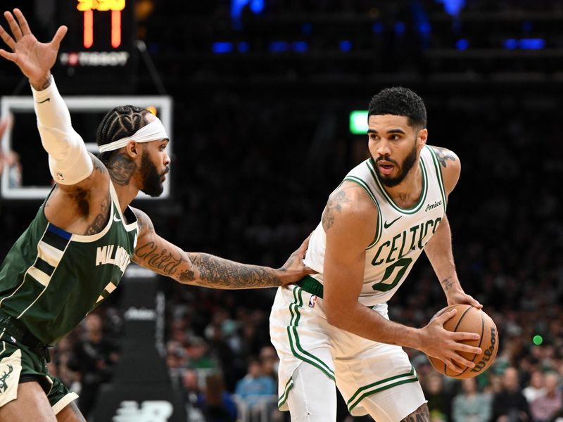 BOSTON, MASSACHUSETTS - OCTOBER 28: Jayson Tatum #0 of the Boston Celtics drives to the basket against Gary Trent Jr. #5 of the Milwaukee Bucks during the second half at the TD Garden on October 28, 2024 in Boston, Massachusetts. NOTE TO USER: User expressly acknowledges and agrees that, by downloading and or using this photograph, User is consenting to the terms and conditions of the Getty Images License Agreement. (Photo by Brian Fluharty/Getty Images)