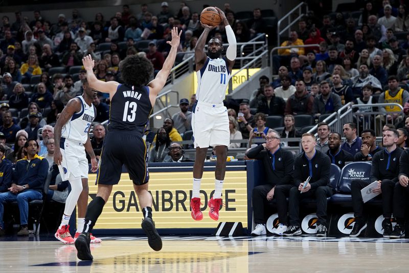 INDIANAPOLIS, INDIANA - MARCH 27: Tim Hardaway Jr. #11 of the Dallas Mavericks attempts a shot while being guarded by Jordan Nwora #13 of the Indiana Pacers in the first quarter at Gainbridge Fieldhouse on March 27, 2023 in Indianapolis, Indiana. NOTE TO USER: User expressly acknowledges and agrees that, by downloading and or using this photograph, User is consenting to the terms and conditions of the Getty Images License Agreement. (Photo by Dylan Buell/Getty Images)