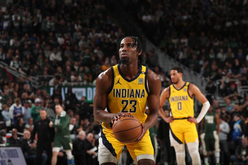 MILWAUKEE, WI - APRIL 21: Aaron Nesmith #23 of the Indiana Pacers shoots a free throw during the game against the Milwaukee Bucks during Round 1 Game 1 of the 2024 NBA Playoffs on April 21, 2024 at the Fiserv Forum Center in Milwaukee, Wisconsin. NOTE TO USER: User expressly acknowledges and agrees that, by downloading and or using this Photograph, user is consenting to the terms and conditions of the Getty Images License Agreement. Mandatory Copyright Notice: Copyright 2024 NBAE (Photo by Gary Dineen/NBAE via Getty Images).