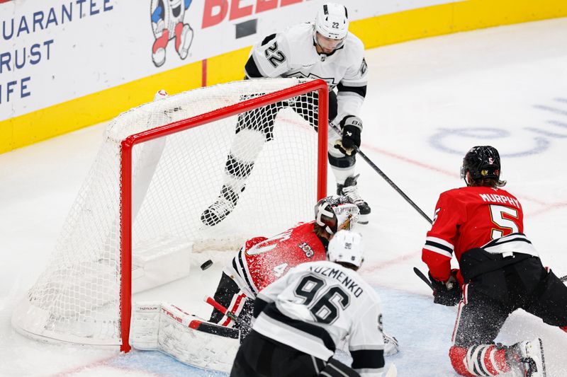 Oct 26, 2025; Chicago, Illinois, USA; Los Angeles Kings left wing Kevin Fiala (22) scores against Chicago Blackhawks goaltender Arvid Soderblom (40) during the second period at United Center. Mandatory Credit: Kamil Krzaczynski-Imagn Images