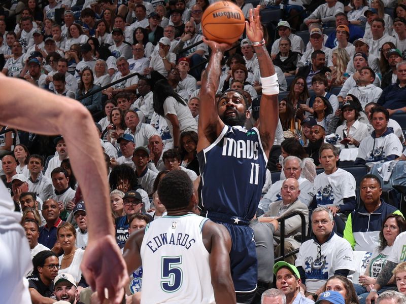 MINNEAPOLIS, MN -  MAY 22:  Kyrie Irving #11 of the Dallas Mavericks shoots the ball during the game  against the Minnesota Timberwolves during Game 1 of the Western Conference Finals of the 2024 NBA Playoffs on May 22, 2024 at Target Center in Minneapolis, Minnesota. NOTE TO USER: User expressly acknowledges and agrees that, by downloading and or using this Photograph, user is consenting to the terms and conditions of the Getty Images License Agreement. Mandatory Copyright Notice: Copyright 2024 NBAE (Photo by David Sherman/NBAE via Getty Images)