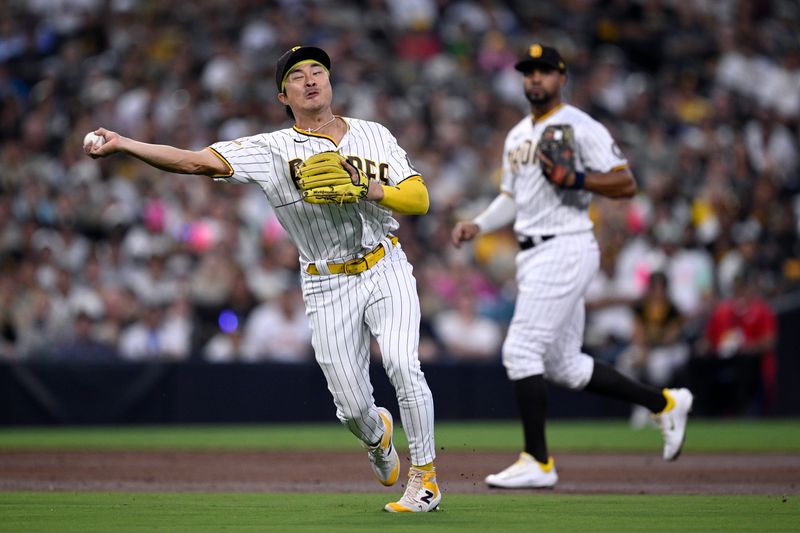 Aug 22, 2023; San Diego, California, USA; San Diego Padres third baseman Ha-seong Kim (7) throws to first base against the Miami Marlins during the third inning at Petco Park. Mandatory Credit: Orlando Ramirez-USA TODAY Sports