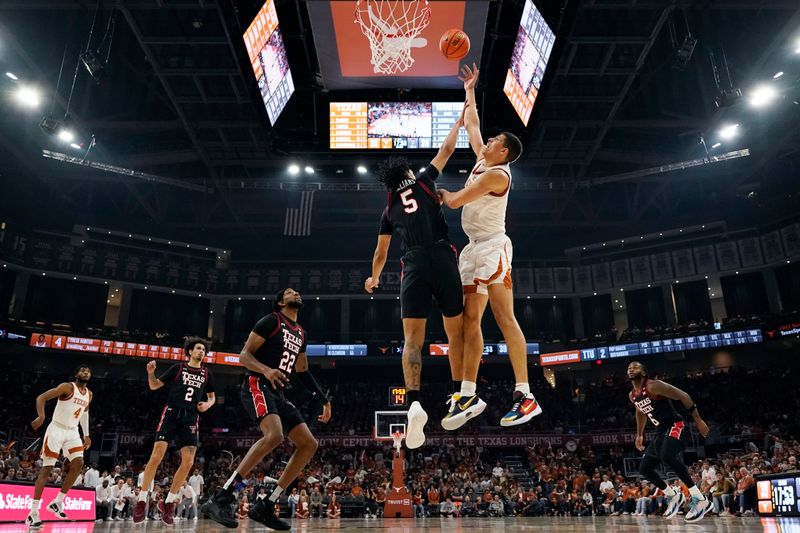 Jan 6, 2024; Austin, Texas, USA; Texas Longhorns forward Kadin Shedrick (5) shoots over Texas Tech Red Raiders guard Darrion Williams (5) during the second half  at Moody Center. Mandatory Credit: Scott Wachter-USA TODAY Sports