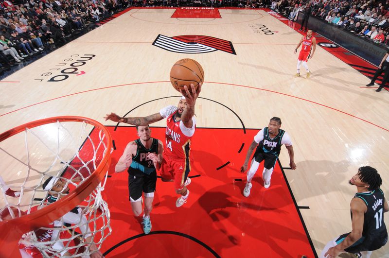 PORTLAND, OR - MARCH 27: Brandon Ingram #14 of the New Orleans Pelicans drives to the basket during the game against the Portland Trail Blazers on March 27, 2023 at the Moda Center Arena in Portland, Oregon. NOTE TO USER: User expressly acknowledges and agrees that, by downloading and or using this photograph, user is consenting to the terms and conditions of the Getty Images License Agreement. Mandatory Copyright Notice: Copyright 2023 NBAE (Photo by Sam Forencich/NBAE via Getty Images)