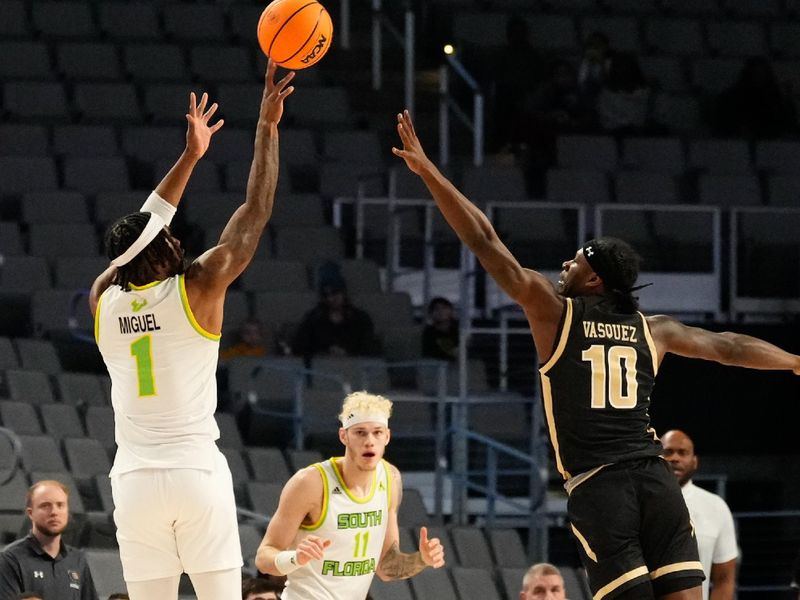 Mar 16, 2024; Fort Worth, TX, USA;  South Florida Bulls guard Selton Miguel (1) scores a three point basket against UAB Blazers guard Alejandro Vasquez (10) during the first half at Dickies Arena. Mandatory Credit: Chris Jones-USA TODAY Sports