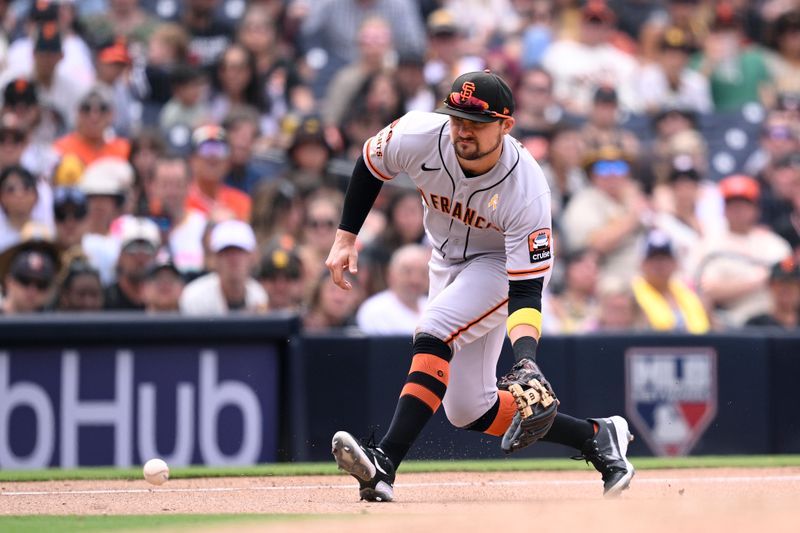 Sep 3, 2023; San Diego, California, USA; San Francisco Giants third baseman J.D. Davis (7)  fields a ground ball during the eighth inning against the San Diego Padres at Petco Park. Mandatory Credit: Orlando Ramirez-USA TODAY Sports