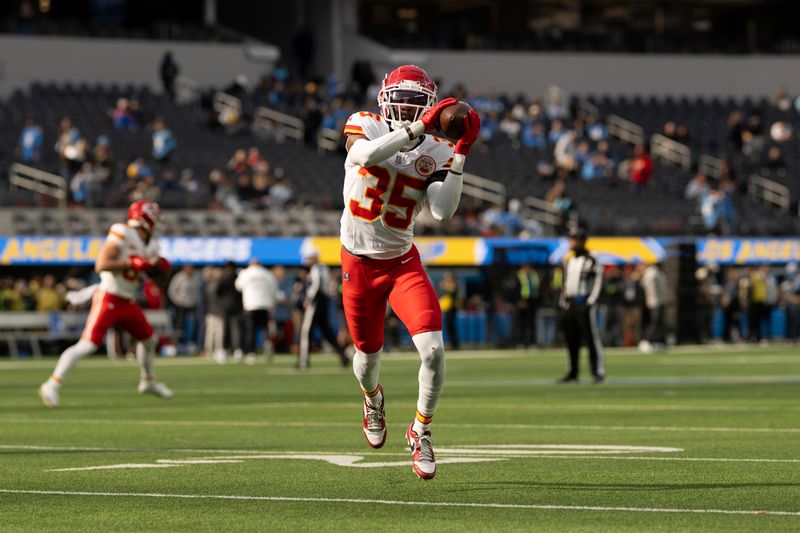 Kansas City Chiefs cornerback Jaylen Watson (35) catches the ball before an NFL football game against the Los Angeles Chargers, Sunday, Jan. 7, 2024, in Inglewood, Calif. (AP Photo/Kyusung Gong)