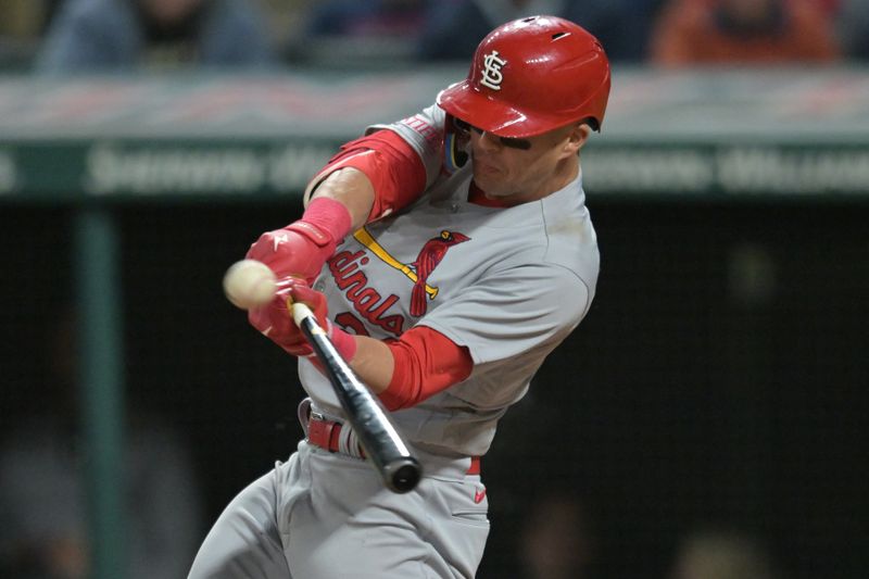 May 26, 2023; Cleveland, Ohio, USA; St. Louis Cardinals center fielder Lars Nootbaar (21) hits an RBI double during the ninth inning against the Cleveland Guardians at Progressive Field. Mandatory Credit: Ken Blaze-USA TODAY Sports