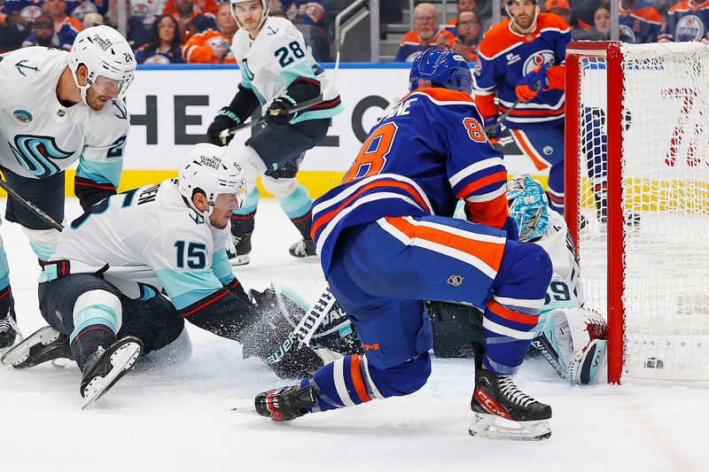 Sep 24, 2025; Edmonton, Alberta, CAN; Edmonton Oilers forward Andrew Mangiapane (88) scores a goal during the third period against Seattle Kraken goaltender Nikke Kakko (39) at Rogers Place. Mandatory Credit: Perry Nelson-Imagn Images