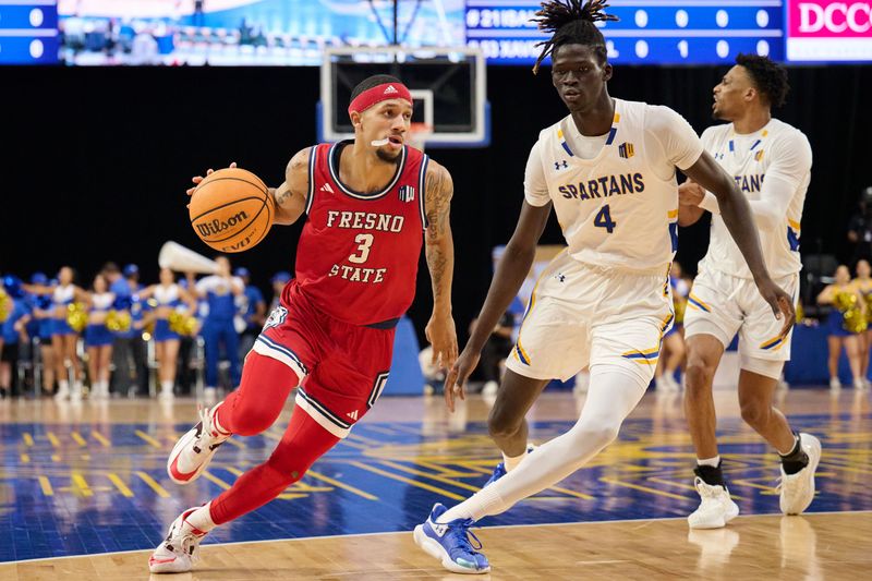 Feb 6, 2024; San Jose, California, USA; Fresno State Bulldogs guard Isaiah Hill (3) dribbles the ball against San Jose State Spartans center Adrame Diongue (4) during the first half at Provident Credit Union Event Center. Mandatory Credit: Robert Edwards-USA TODAY Sports