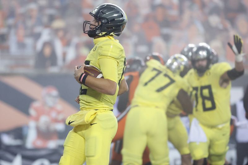 Nov 27, 2020; Corvallis, Oregon, USA; Oregon Ducks  quarterback Jay Butterfield (9) runs the ball for a touchdown against the Oregon State Beavers during the first half at Reser Stadium. Mandatory Credit: Soobum Im-USA TODAY Sports