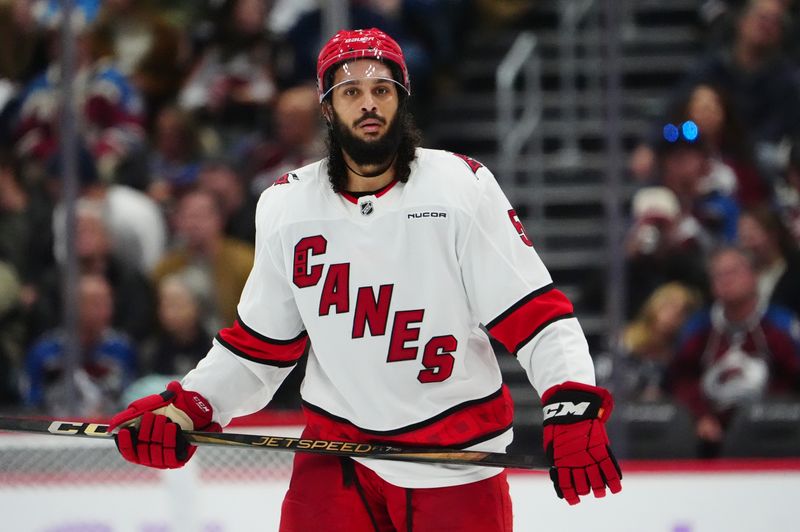 Nov 9, 2024; Denver, Colorado, USA; Carolina Hurricanes defenseman Jalen Chatfield (5) during the third period against the Colorado Avalanche at Ball Arena. Mandatory Credit: Ron Chenoy-Imagn Images