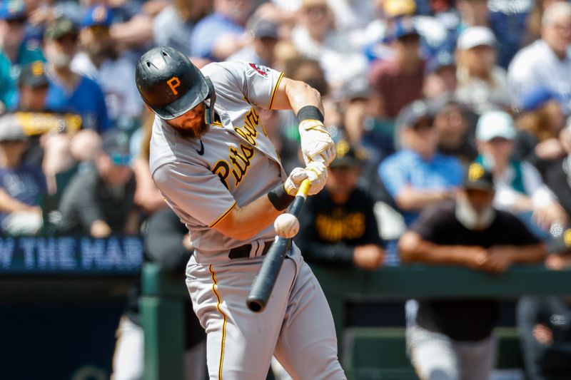 May 28, 2023; Seattle, Washington, USA; Pittsburgh Pirates second baseman Chris Owings (38) hits a single against the Seattle Mariners during the fifth inning at T-Mobile Park. Mandatory Credit: Joe Nicholson-USA TODAY Sports