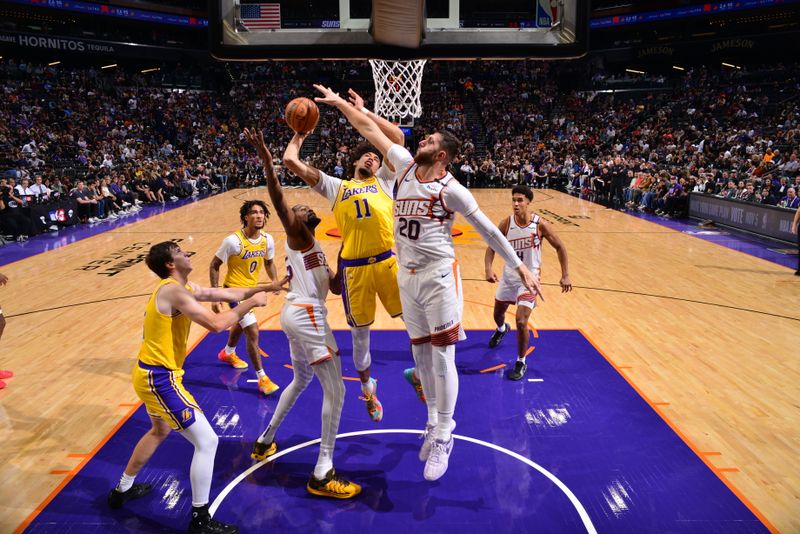 PHOENIX, AZ - OCTOBER 17: Jaxson Hayes #11 of the Los Angeles Lakers drives to the basket during the game against the Phoenix Suns during a NBA Preseason game on October 17, 2024 at Footprint Center in Phoenix, Arizona. NOTE TO USER: User expressly acknowledges and agrees that, by downloading and or using this photograph, user is consenting to the terms and conditions of the Getty Images License Agreement. Mandatory Copyright Notice: Copyright 2024 NBAE (Photo by Barry Gossage/NBAE via Getty Images)