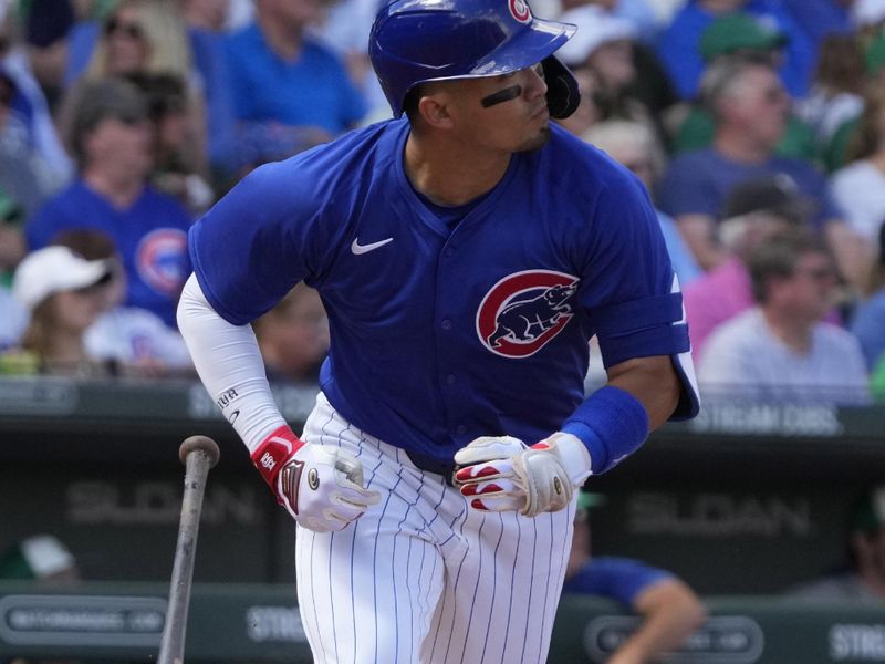 Mar 17, 2024; Mesa, Arizona, USA; Chicago Cubs right fielder Seiya Suzuki (27) hits a double against the Texas Rangers in the first inning at Sloan Park. Mandatory Credit: Rick Scuteri-USA TODAY Sports