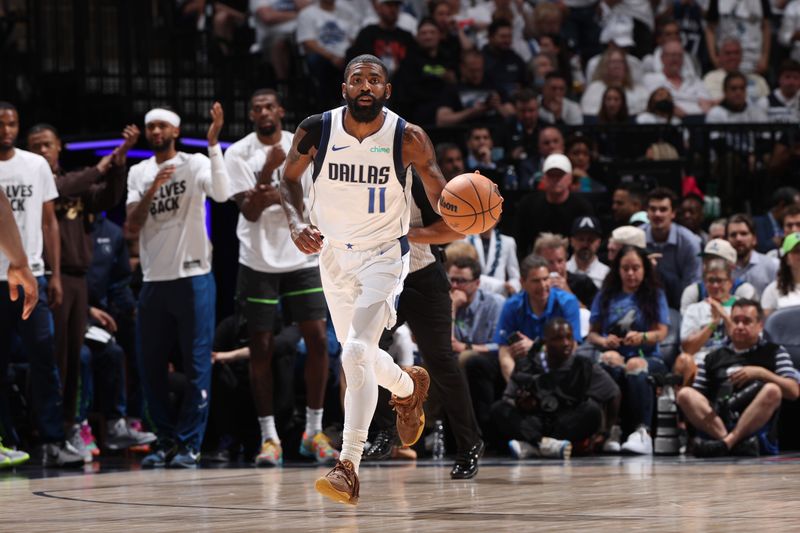 MINNEAPOLIS, MN - MAY 30: Kyrie Irving #11 of the Dallas Mavericks dribbles the ball during the game against the Minnesota Timberwolves during Round 3 Game 5 of the 2024 NBA Playoffs on May 30, 2024 at Target Center in Minneapolis, Minnesota. NOTE TO USER: User expressly acknowledges and agrees that, by downloading and or using this Photograph, user is consenting to the terms and conditions of the Getty Images License Agreement. Mandatory Copyright Notice: Copyright 2024 NBAE (Photo by Joe Murphy/NBAE via Getty Images)